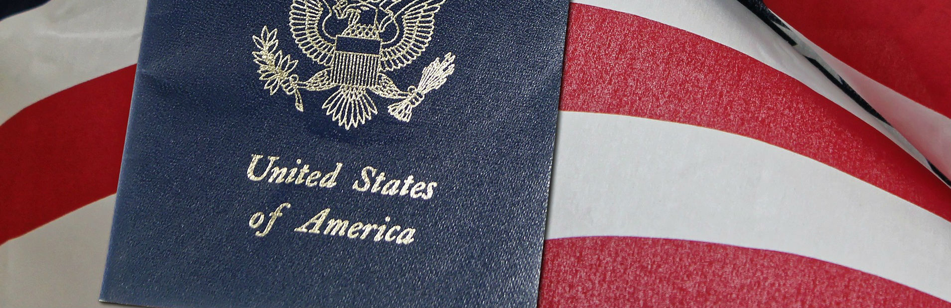 A United States passport resting on an American flag
